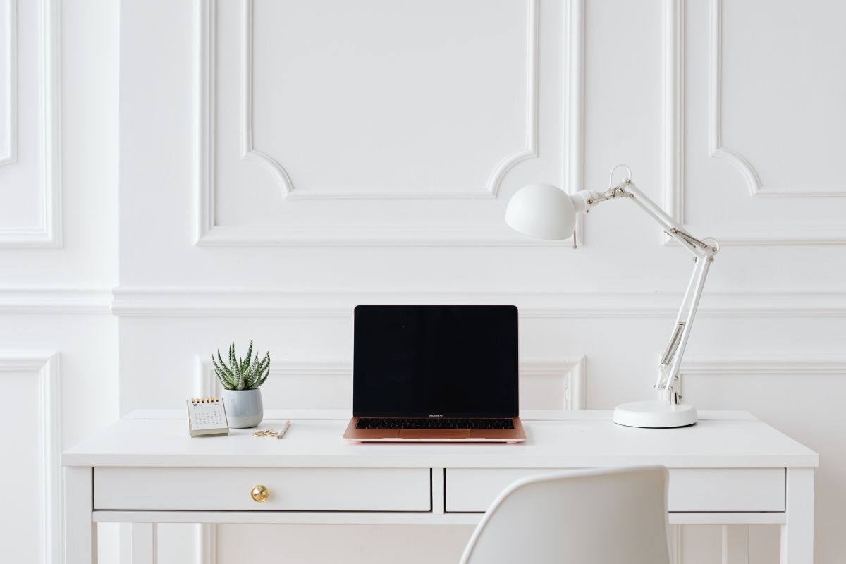 laptop on white desk