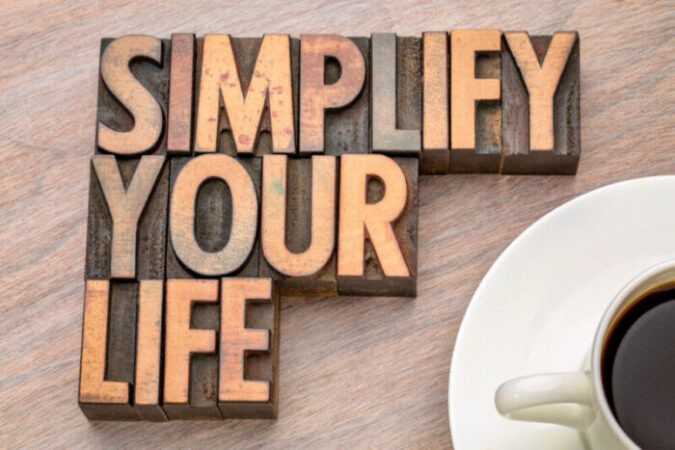 simplify your life advice - word abstract in vintage letterpress wood type with a cup of coffee