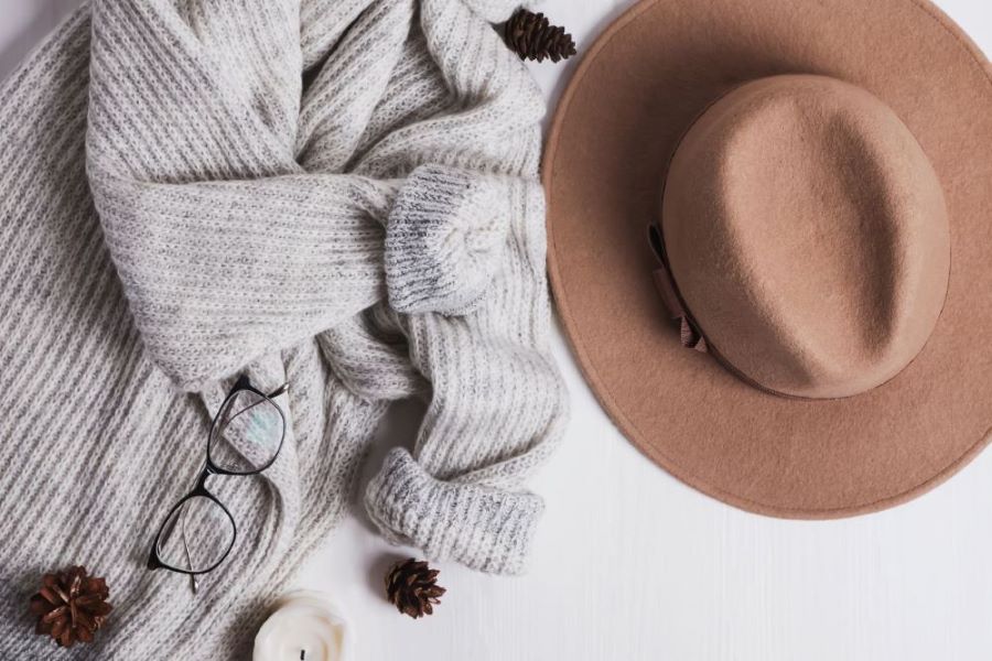 heather grey sweater taupe hat and eyeglasses