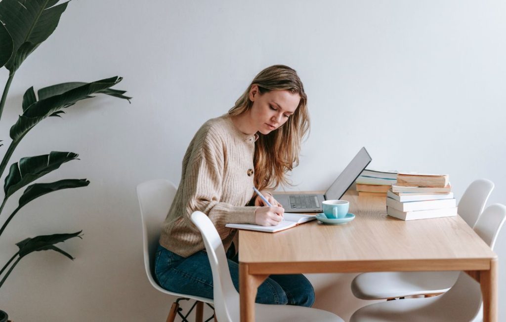 woman writing top priorities