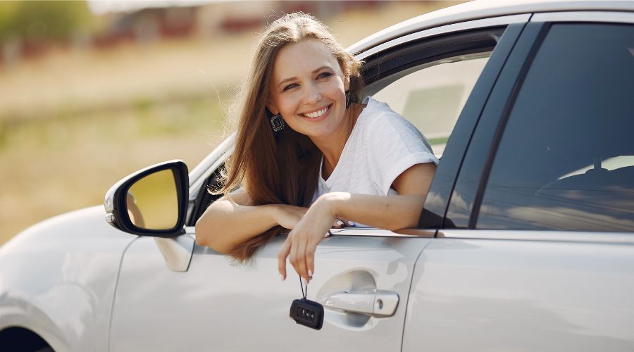 woman sitting in white car