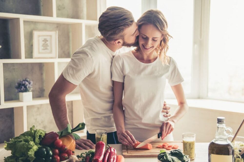 happy couple cooking together