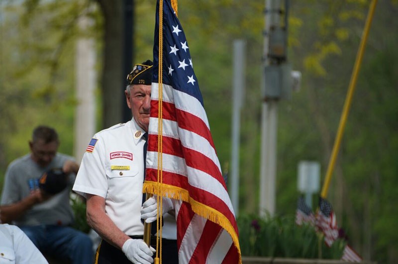 memorial day parade - senior with flag