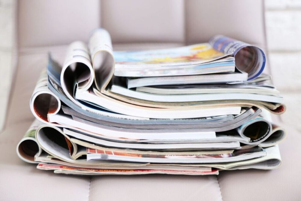 Stack of Magazines on Leather Chair, Close up