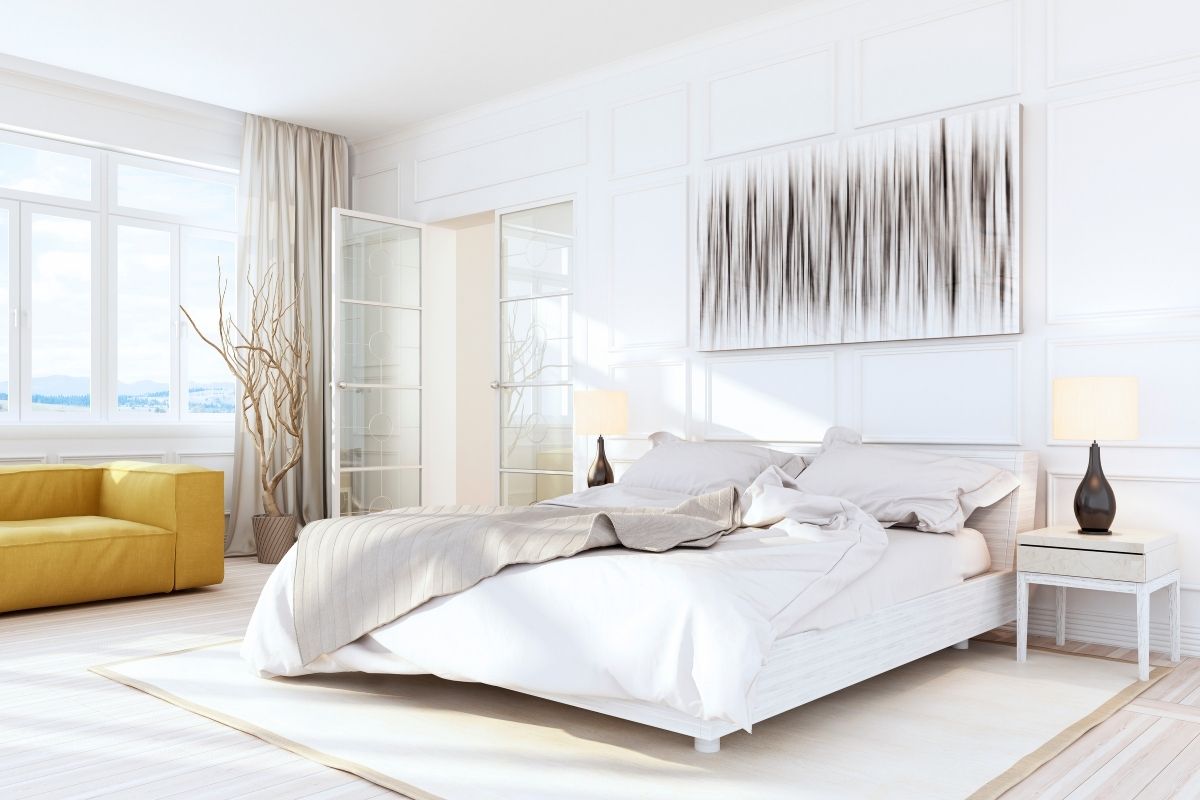 White-Luxury-Bedroom-Interior-with-mustard-yellow-sofa