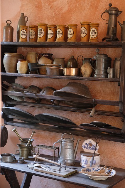vintage kitchen open shelves organized pottery wood bowls