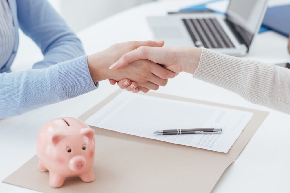 handshake pink piggy bank