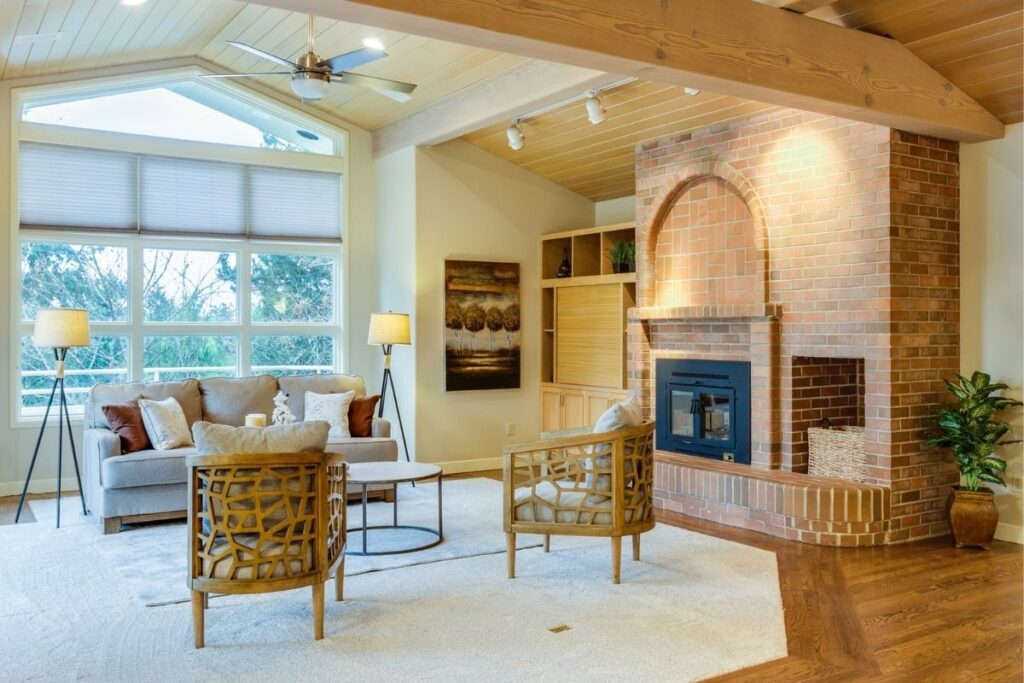Neutral color living room brick fireplace