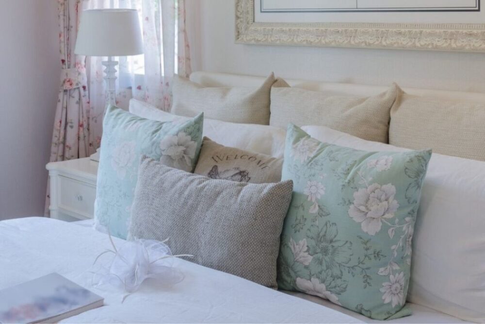 vintage color throw pillows on luxury bed