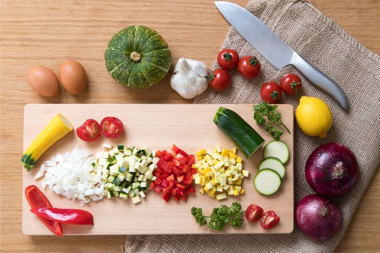 multiple cut vegatables cutting board knife