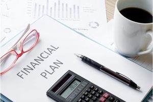 financial planning calculator red rimmed glasses