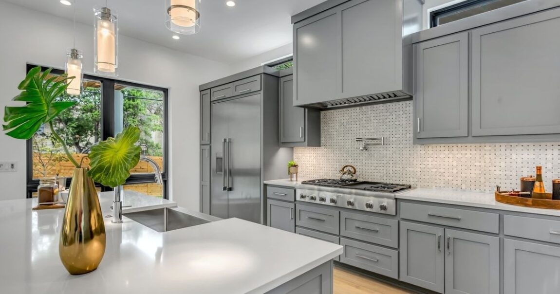Gray kitchen cabinets Carrara marble backsplash
