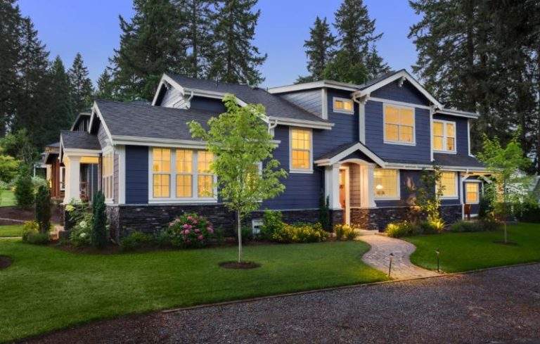 dark blue home exterior landscaped yard
