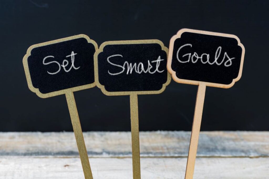 set smart goals written on mini chalkboard labels