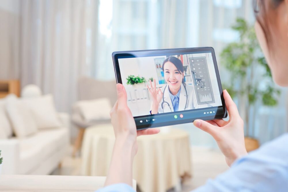 female doctor on tablet telemedicine
