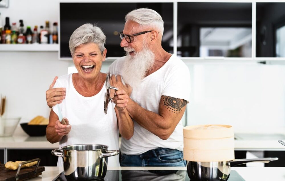 Retired couple cooking together
