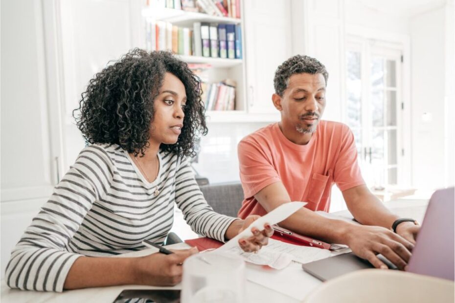 A couple practicing personal financial forecasting.