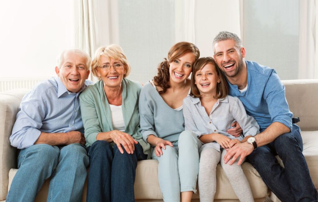 Multi generation family sitting together on the sofa